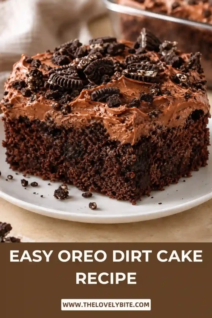 Chocolate Oreo cake layered with hot fudge, chocolate pudding, cookies-and-cream topping, and crushed Oreos. A sliced portion reveals the moist cake and creamy pudding layers.