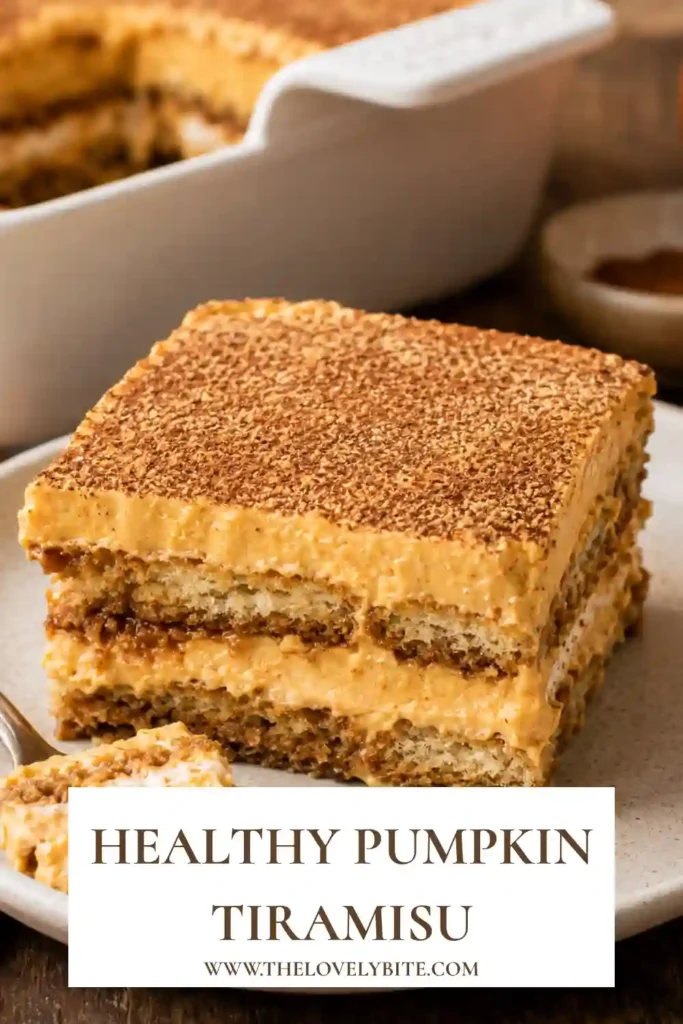 Pumpkin Tiramisu layered with coffee-soaked ladyfingers and creamy pumpkin mascarpone filling. A generous dusting of dark cocoa powder finishes this no-bake fall dessert.