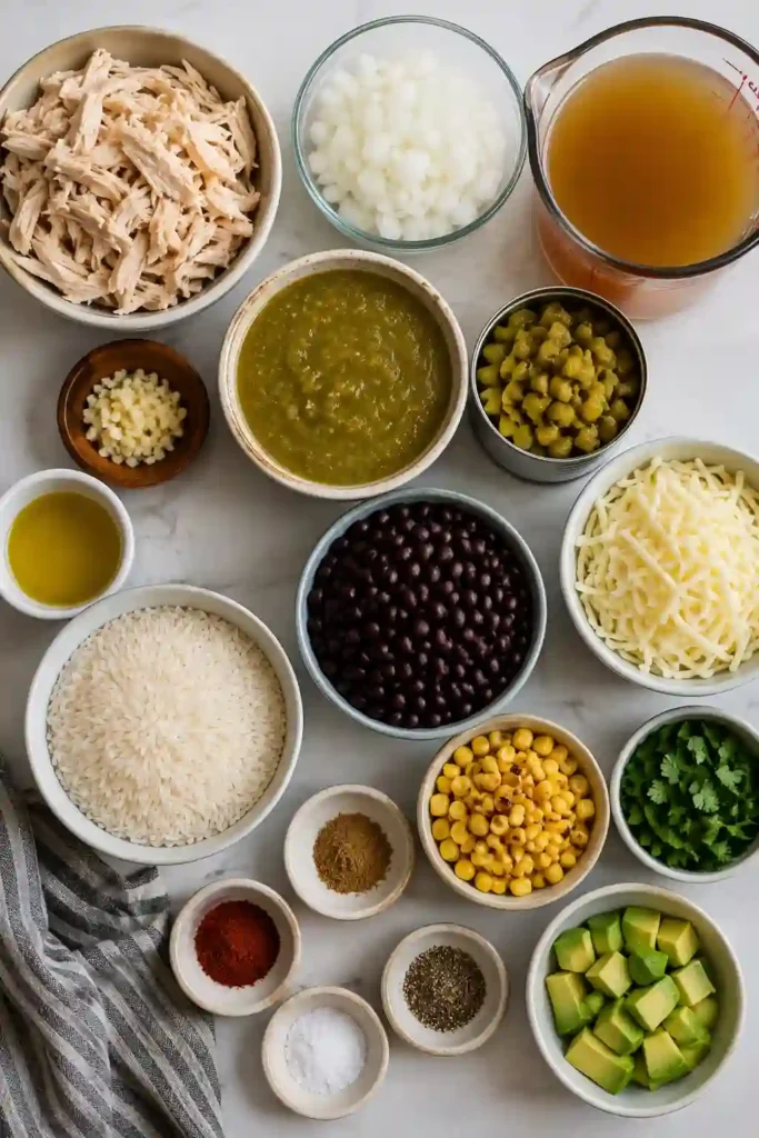 A comforting skillet of green chile chicken and rice topped with melted Monterey Jack cheese and fresh cilantro. Black beans, roasted corn, and salsa verde make this an easy and filling weeknight meal