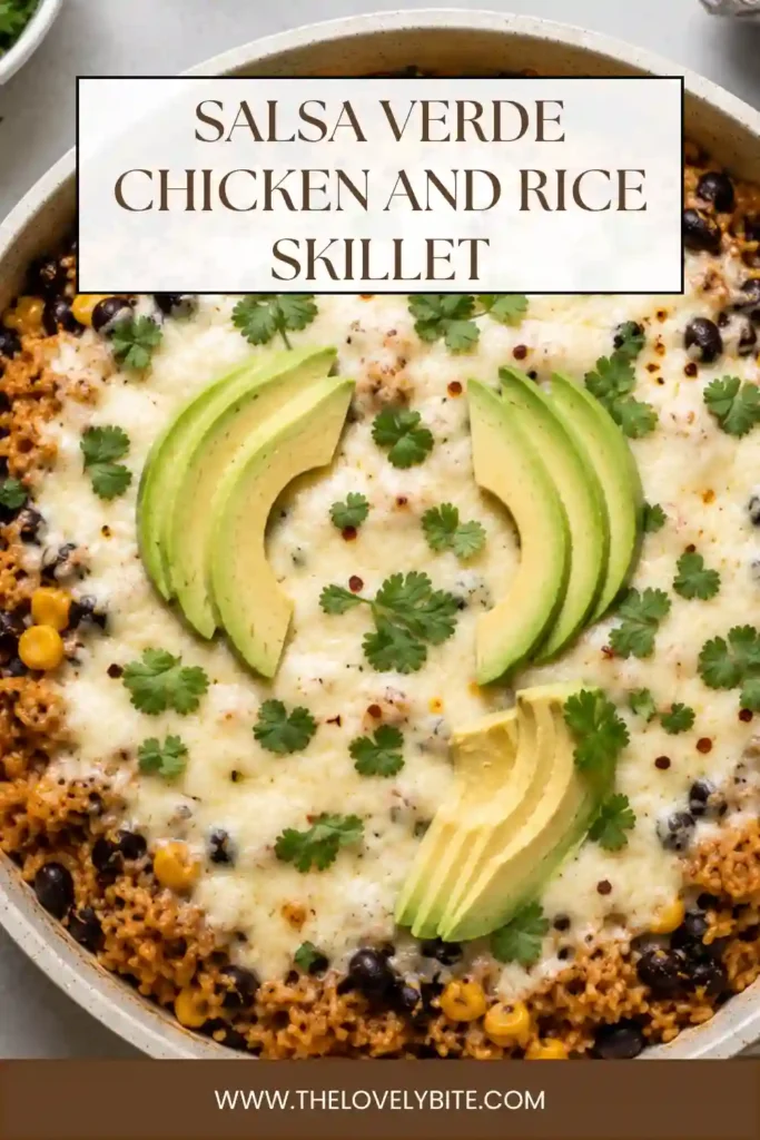 Close-up view of a chicken rice skillet featuring shredded chicken, salsa verde, white rice, black beans, corn, and green chiles. Golden melted cheese and fresh cilantro finish the hearty Mexican-inspired dinner.