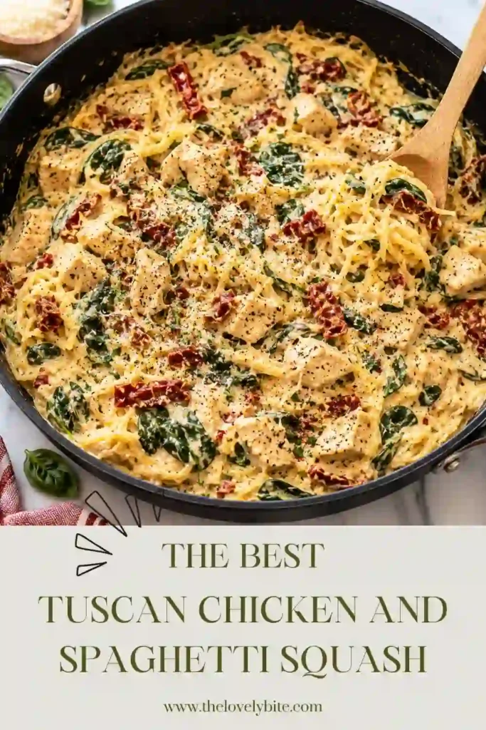 A close-up of creamy Tuscan chicken with spaghetti squash, Parmesan, spinach, garlic, and sun-dried tomatoes. The sauce clings to the squash strands and chicken pieces for a rich, comforting meal.