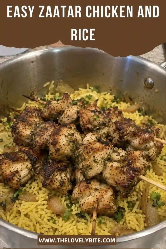 Zaatar chicken and rice served with charred chicken skewers over fluffy basmati rice and a creamy garlic yogurt sauce. The dish features golden chicken, fresh herbs, red onion, and warm Middle Eastern spices.