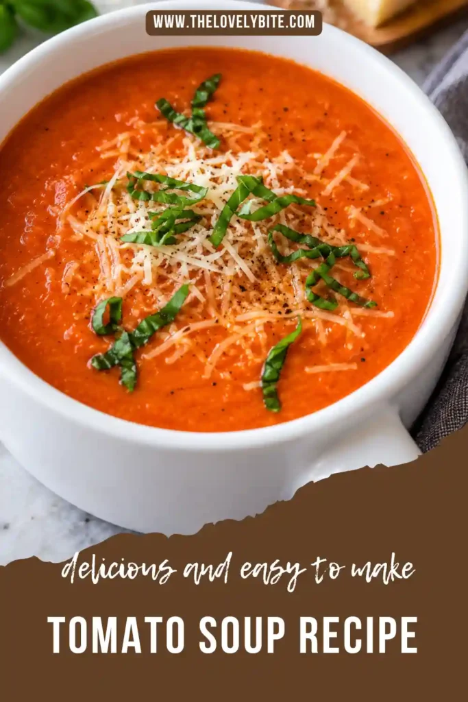 Creamy Easy Tomato Soup Recipe served in a bowl with fresh basil and grated Parmesan. The homemade tomato soup has a smooth texture and rich red-orange color.