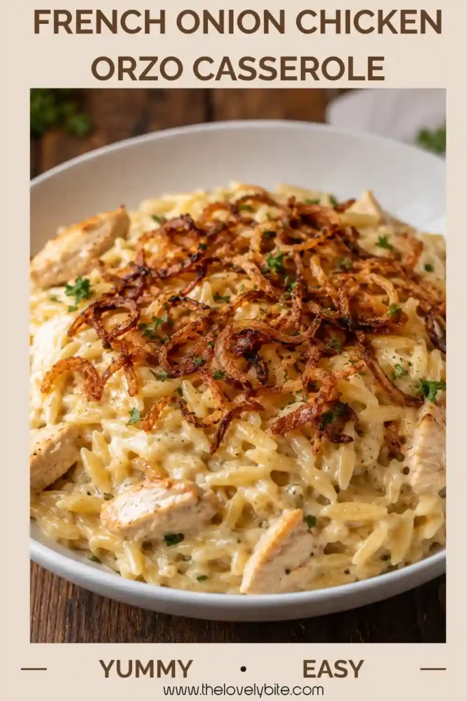 Close-up of creamy chicken orzo casserole topped with melted mozzarella and Parmesan. Golden caramelized onions and tender chicken add texture and flavor to this comforting dinner.