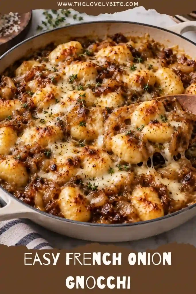 French Onion Gnocchi served hot in an oven-safe skillet with caramelized yellow onions, melted Parmesan, and Gruyère. The cheesy topping is golden and bubbling around tender gnocchi.