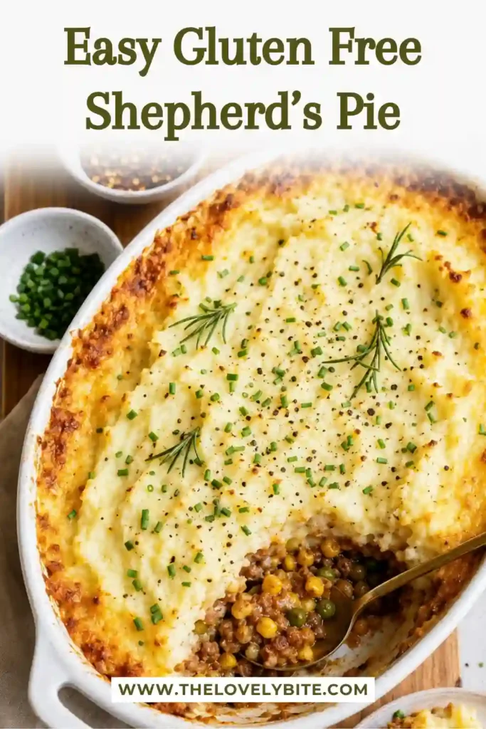 A serving of gluten free shepherd’s pie showing fluffy mashed potatoes over seasoned ground beef and vegetables. Fresh herbs add a bright finishing touch to this comforting dinner.