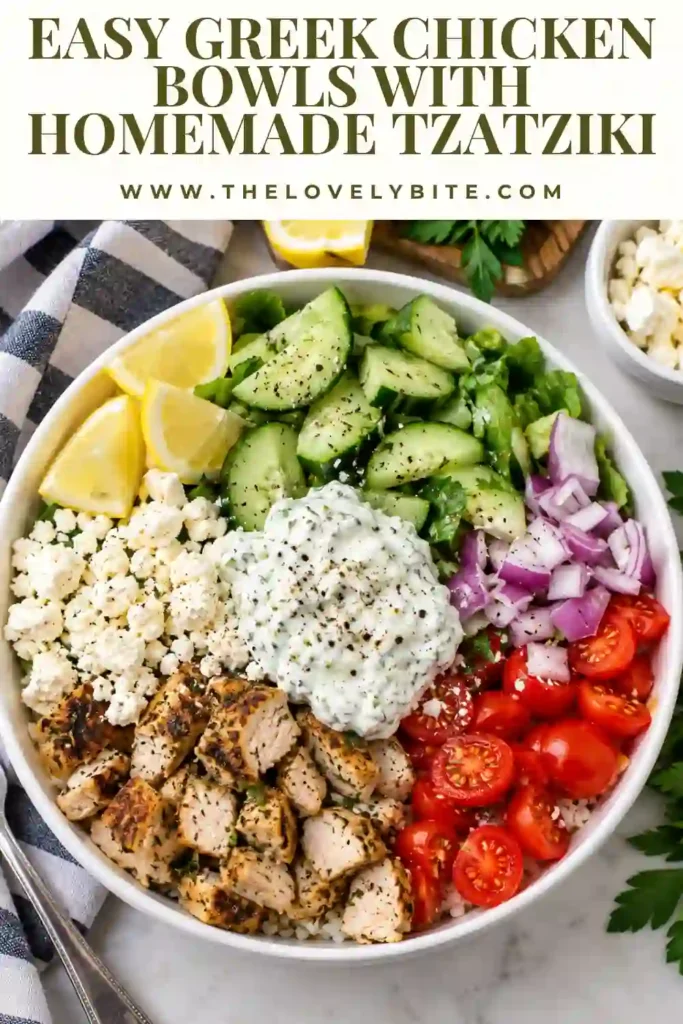 Four Greek chicken meal prep bowls filled with seasoned chicken, cooked rice, fresh vegetables, and feta cheese. Homemade tzatziki sauce is stored separately to keep the ingredients fresh until serving.