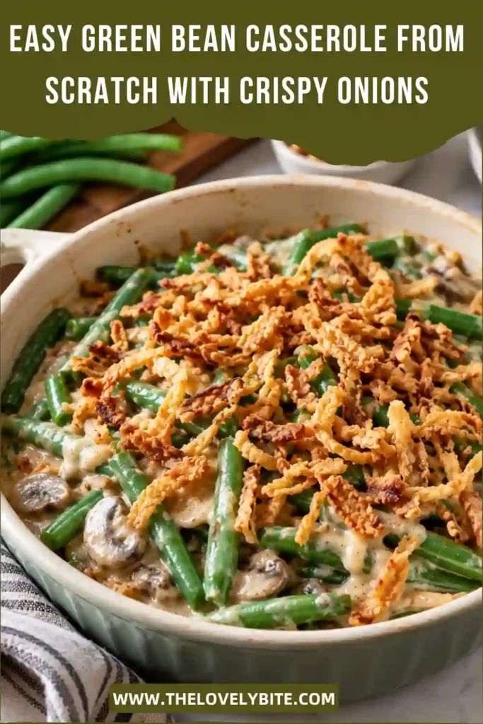 Close-up of creamy green bean casserole with fresh green beans, sliced mushrooms, and golden onion topping. The homemade mushroom sauce coats the vegetables beneath a layer of crispy baked onions.