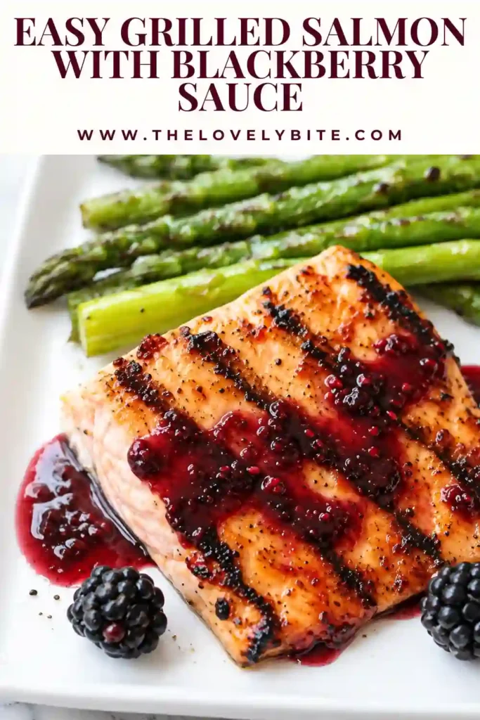 Easy grilled salmon served with homemade salmon with blackberry sauce and fresh green vegetables. The colorful plate showcases tender salmon fillets alongside a smooth berry sauce.