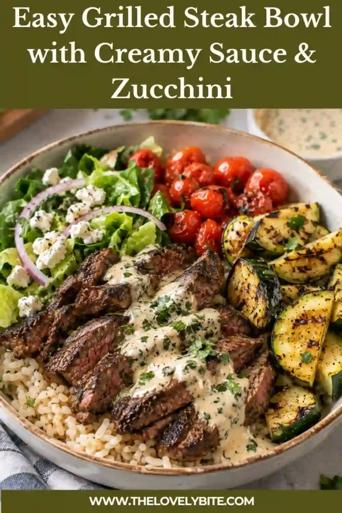 Overhead view of a healthy steak bowl with grilled zucchini, sliced beef, and fluffy quinoa. A creamy yogurt garlic sauce adds a tangy finishing touch to this protein-rich meal.