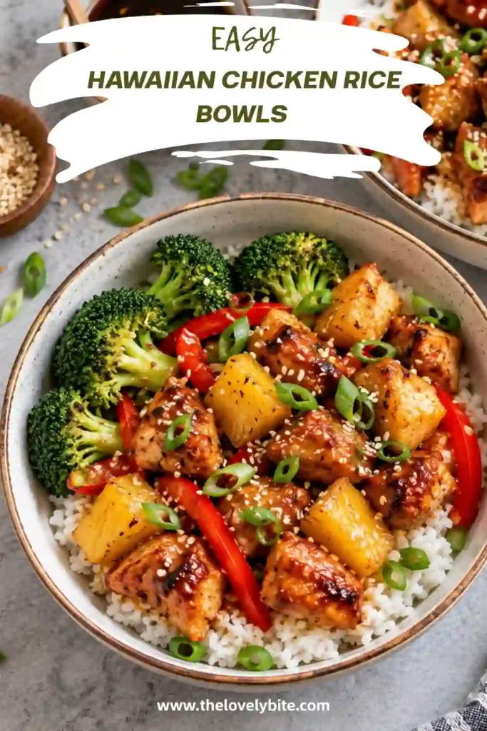 Overhead view of a Hawaiian-inspired chicken rice bowl arranged with fluffy jasmine rice, glazed chicken, pineapple, and red bell peppers. Fresh green onions and sesame seeds add color and texture to this easy family dinner.