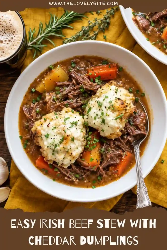 Homemade beef stew with dumplings featuring fork-tender beef and chunky vegetables in a rich broth. Soft cheddar chive dumplings add a cheesy, savory finish.