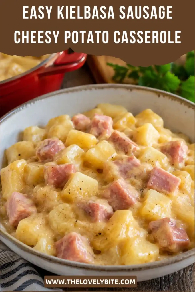 A hearty sausage potato casserole served in a baking dish with golden melted cheese across the top. Small cubes of tender potato and browned beef sausage are surrounded by creamy cheddar sauce.