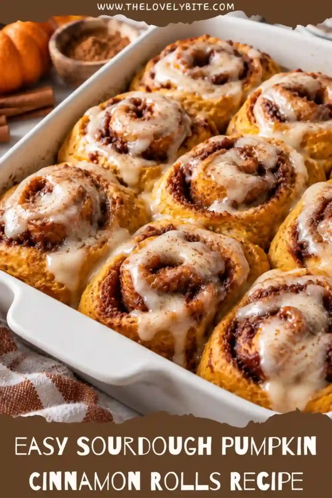 Soft pumpkin sourdough cinnamon rolls baked until golden brown and topped with creamy vanilla glaze. The homemade rolls are made with pumpkin puree, sourdough discard, and a spiced brown sugar filling.