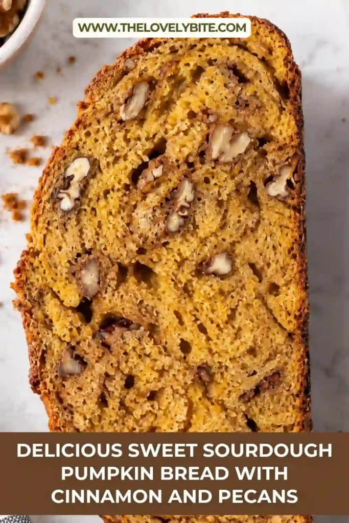 Homemade cinnamon pecan sourdough made with active starter and roasted pumpkin. The sliced loaf reveals a tender pumpkin crumb with a sweet spiced pecan filling.