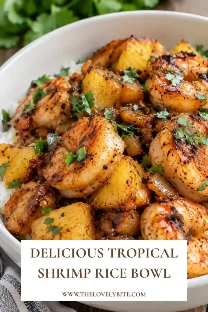 Homemade tropical shrimp rice bowl served with jasmine rice, pineapple chunks, and lime-marinated shrimp. Fresh cilantro and a golden pineapple sauce bring color and freshness to the dish.