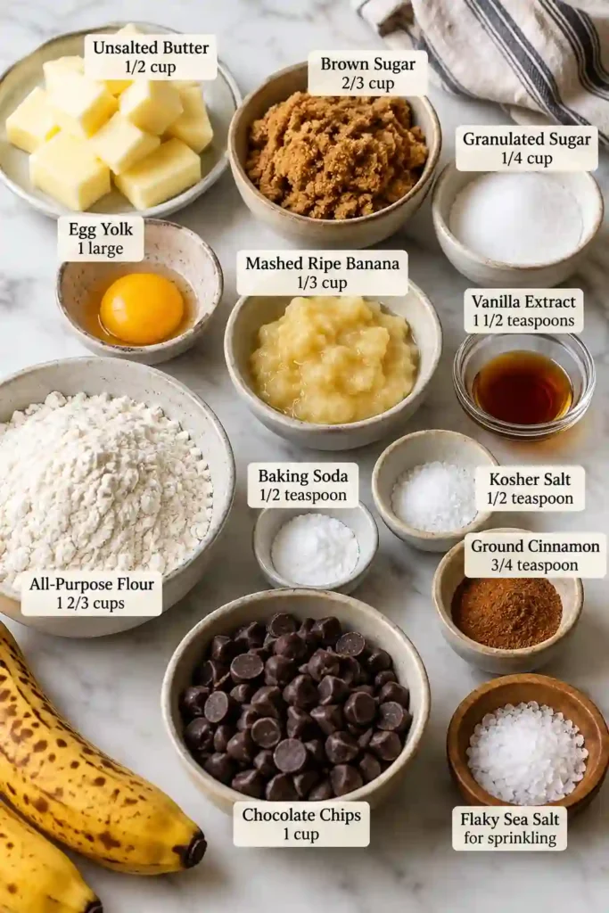 Freshly baked Banana Bread Chocolate Chip Cookies with soft centers, golden edges, and melted chocolate chunks. Flaky sea salt finishes these chewy banana cookies.