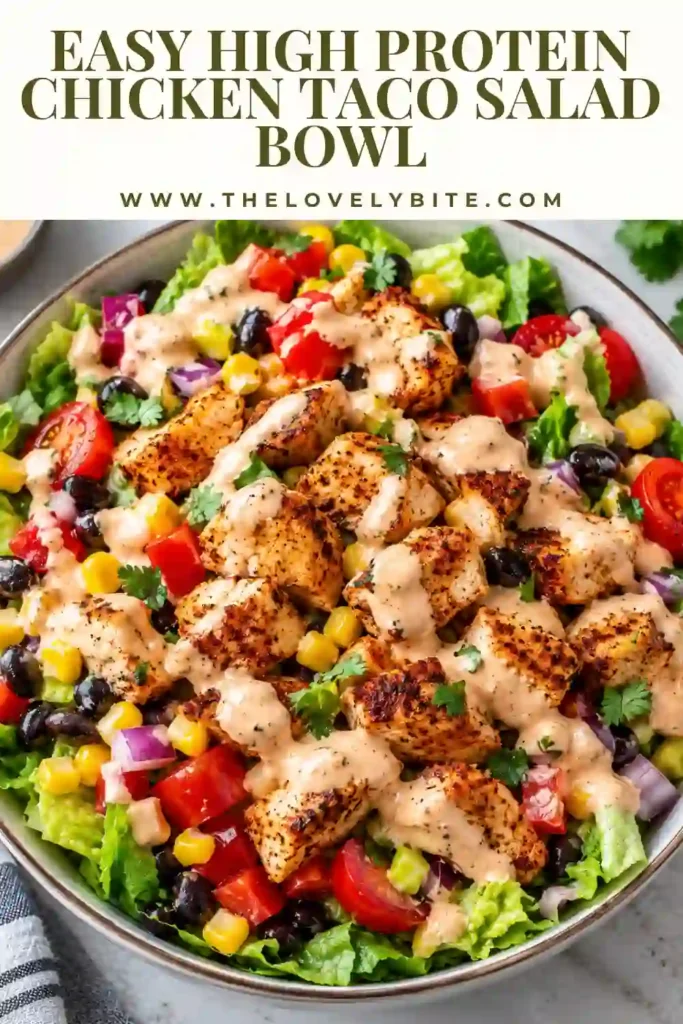 Healthy chicken taco salad served over crisp romaine with juicy chicken breast, colorful vegetables, black beans, corn, and shredded cheese. Fresh lime and cilantro complete the Tex-Mex-inspired bowl.