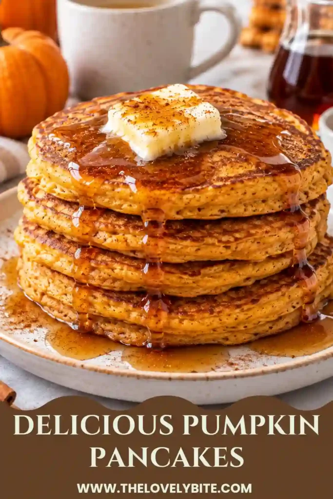 A warm stack of easy Pumpkin Pancakes made with pumpkin puree, cinnamon, ginger, and nutmeg. The fluffy pancakes are served as a cozy fall breakfast.